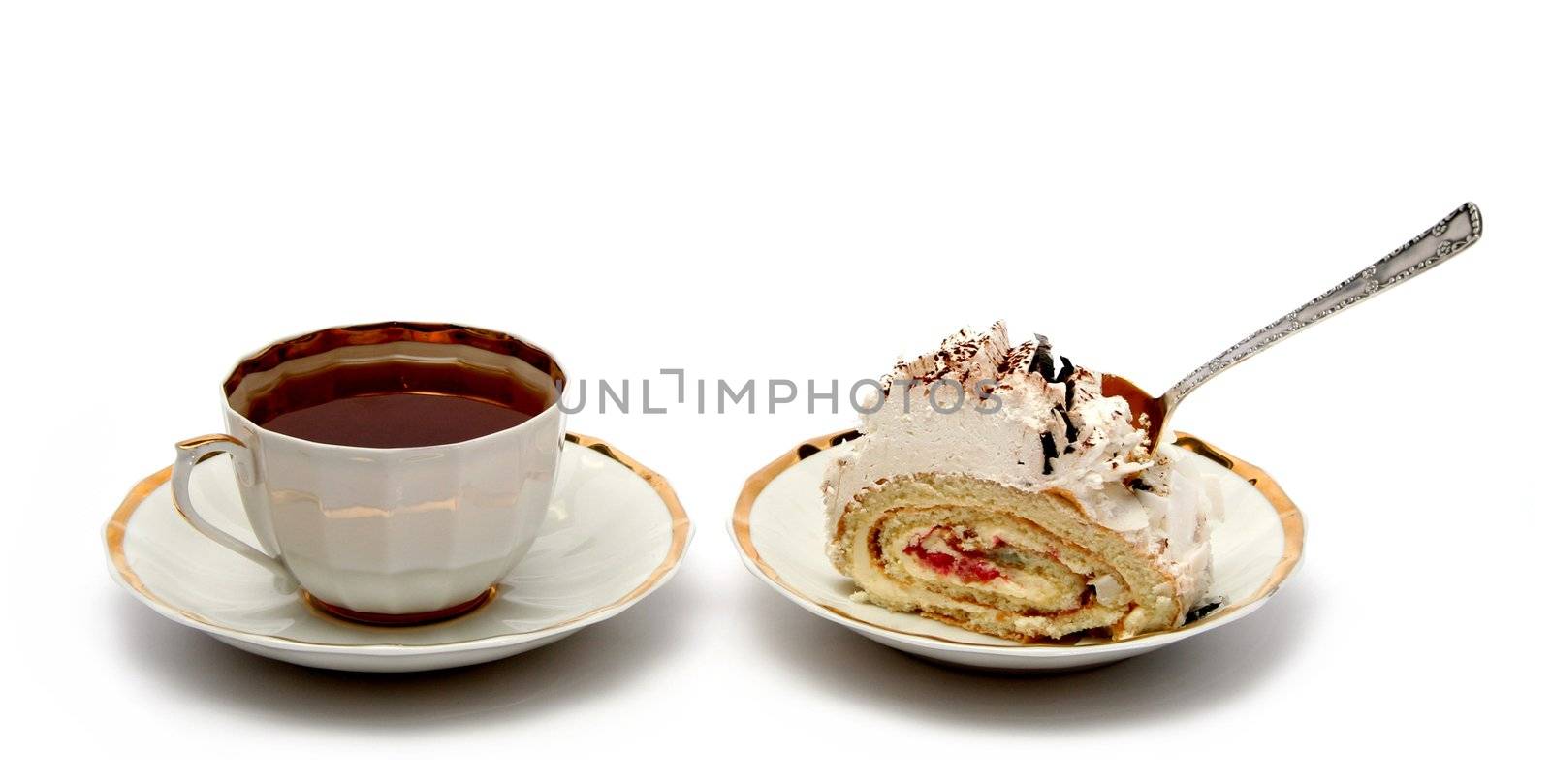 Cup of tea with the spoon and slice of pie on white