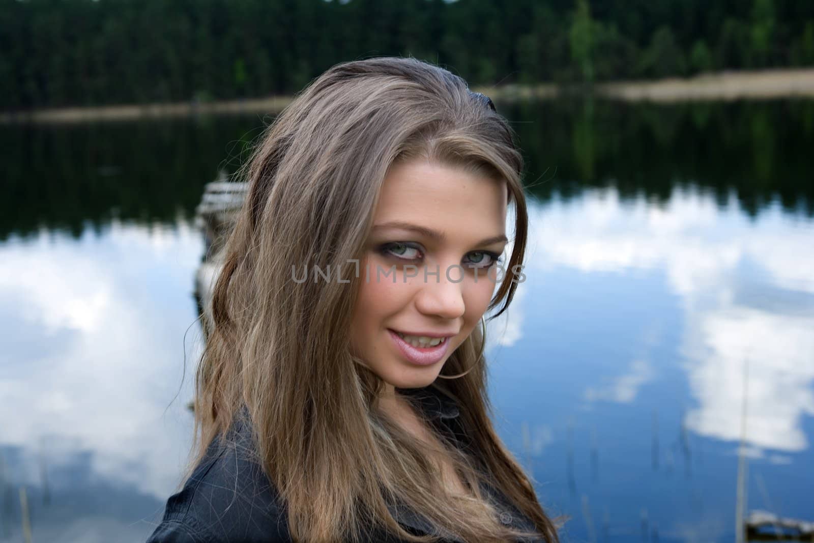  Portrait of young sexual girl on lake background