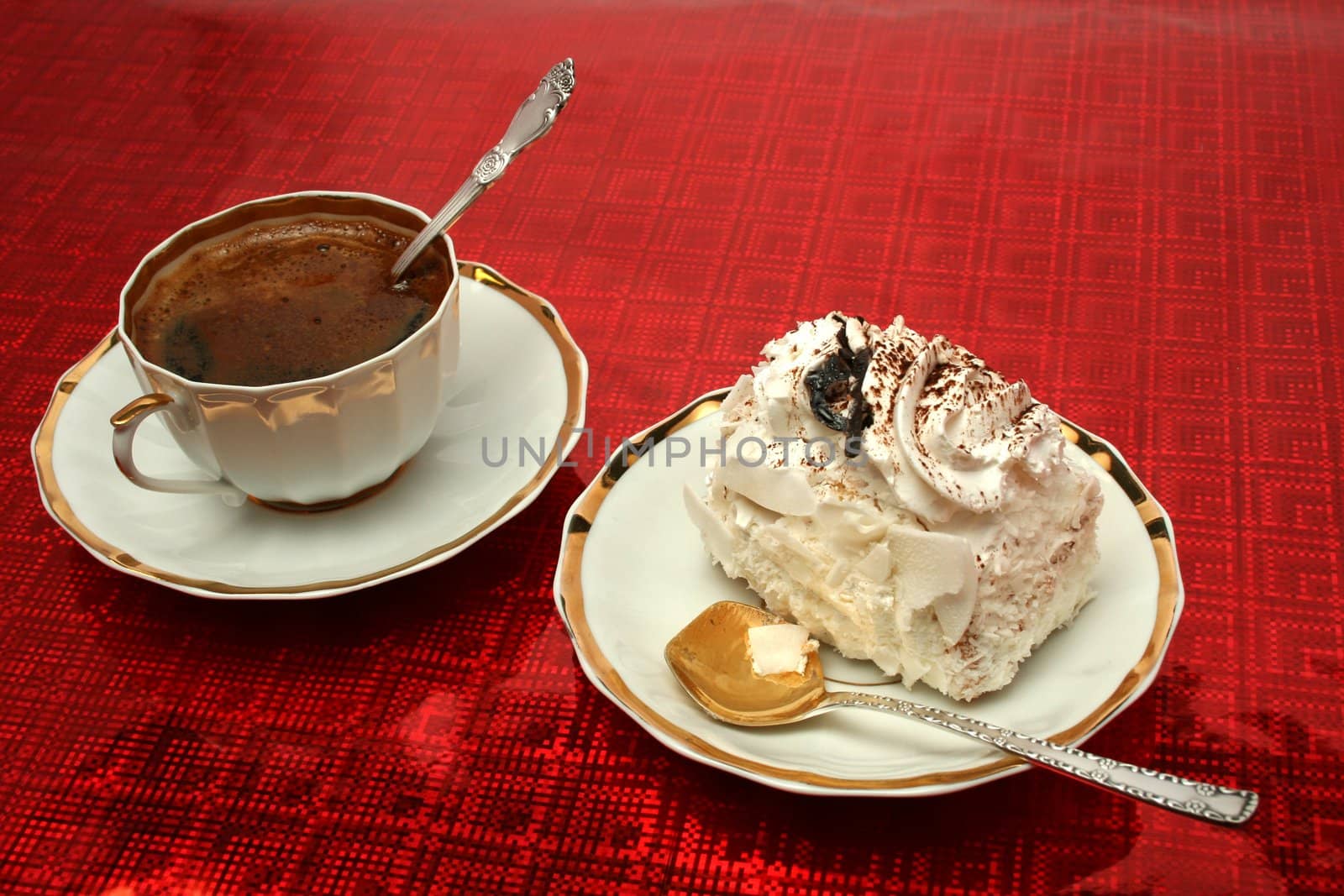 Cup of coffee with the spoon and a slice of pie on red background, (look similar images in my portfolio)