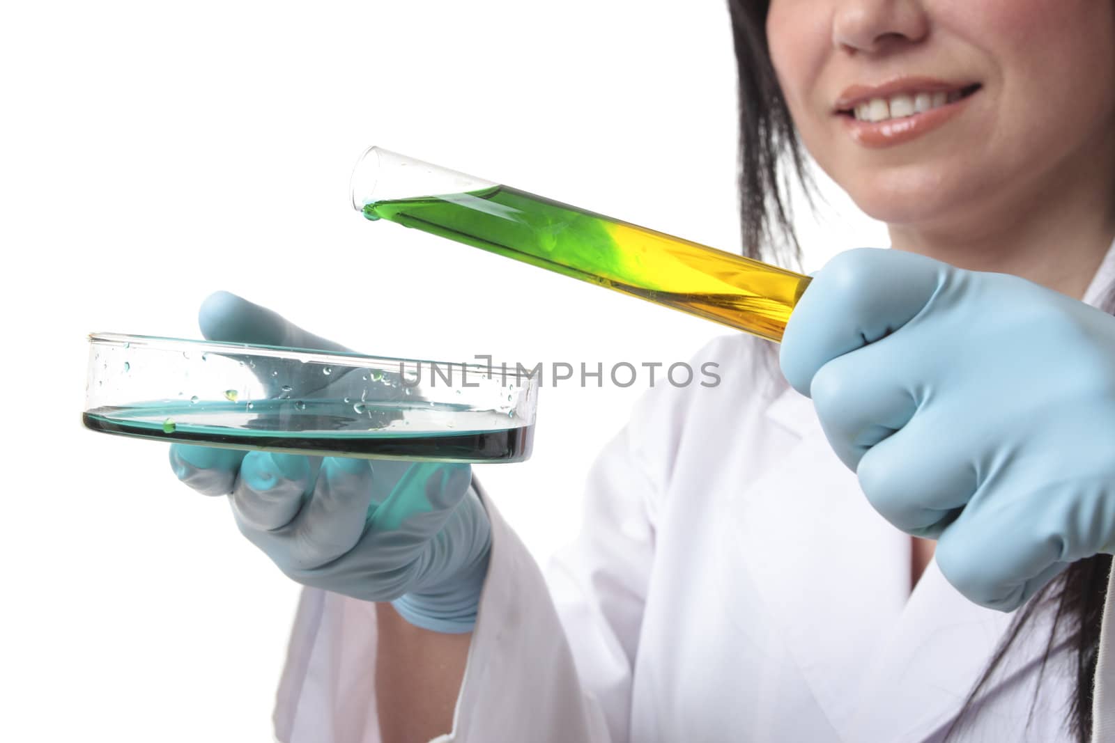 Laboratory research worker with test tube and petri dish