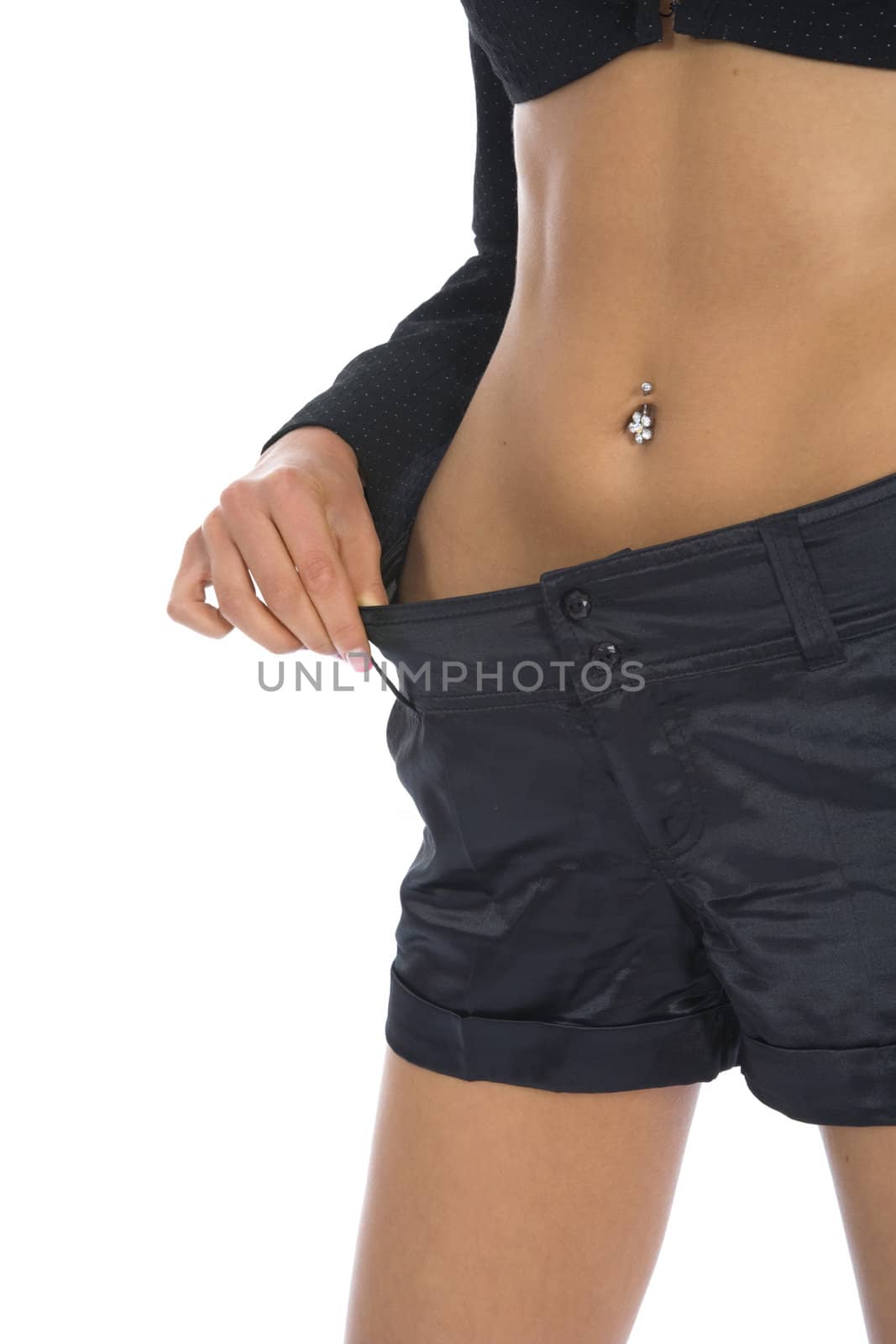 Woman showing how much weight she lost on insulated background