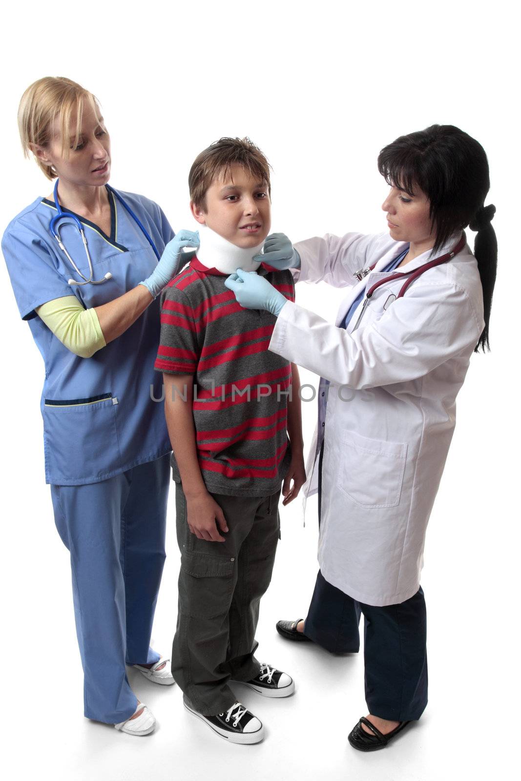 Medical staff place a neck brace on an injured boy.  Neck braces  immobilize and support the spine when there is a condition that needs to be treated.