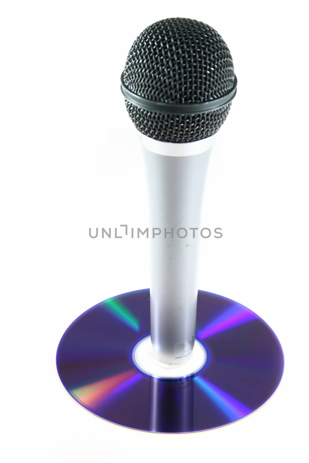 isolated microphone on blue disc as symbol for sound and music