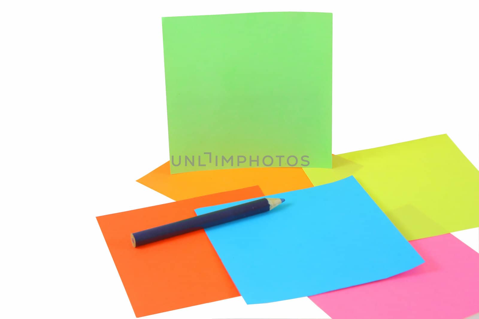 colored papers and pen isolated on white background