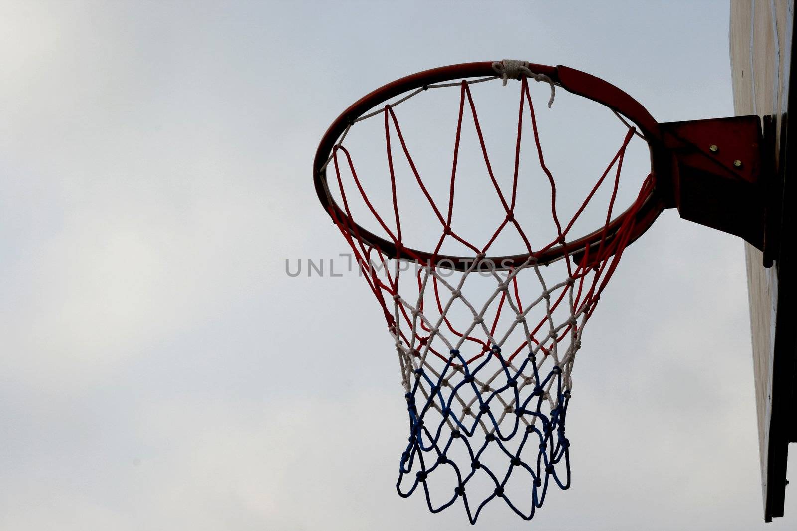 Basketball ring hoop and net with sky as background-with copy space