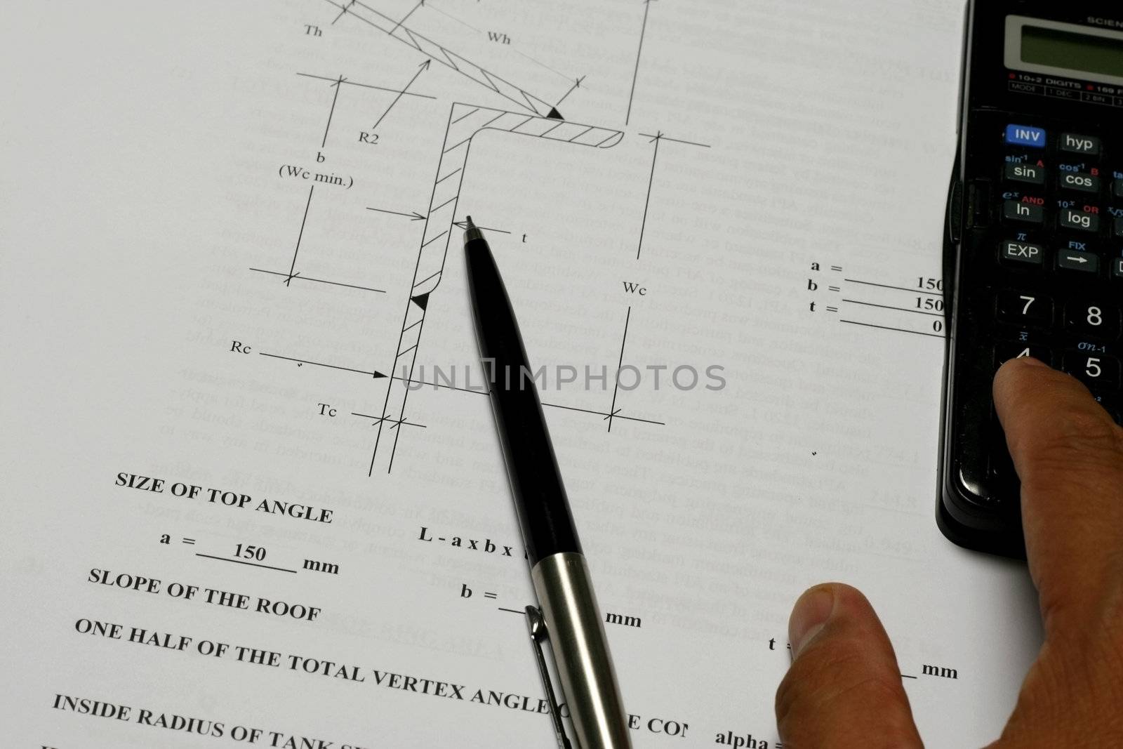 An engineer calculating his design with calculator