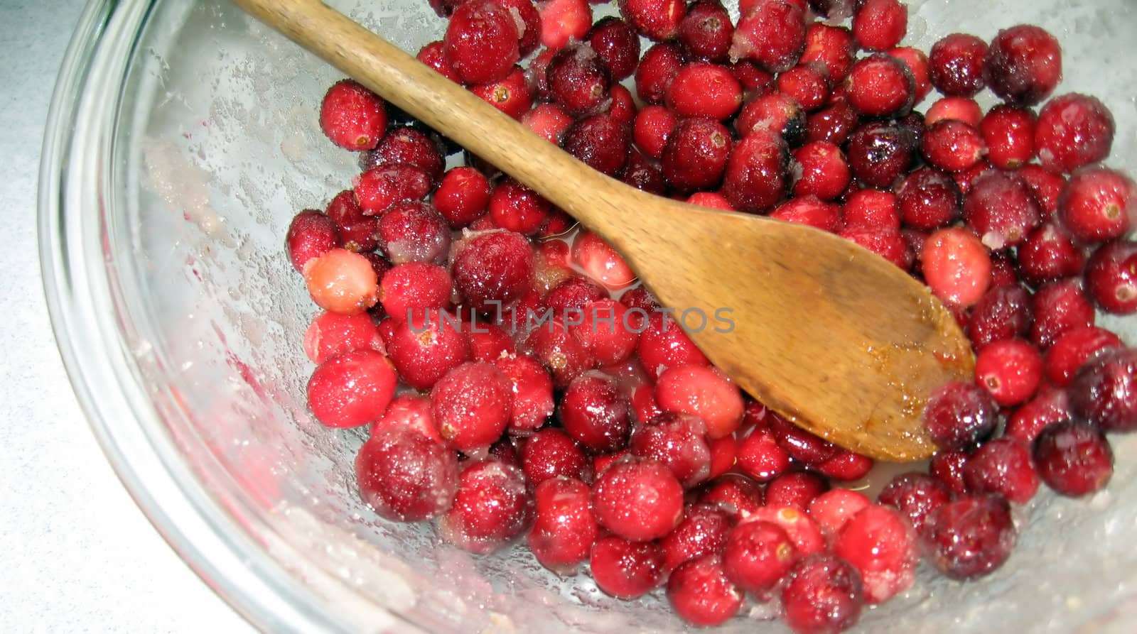 Cranberries with Sugar in Bowl, with Antique Wooden Spoon by loongirl
