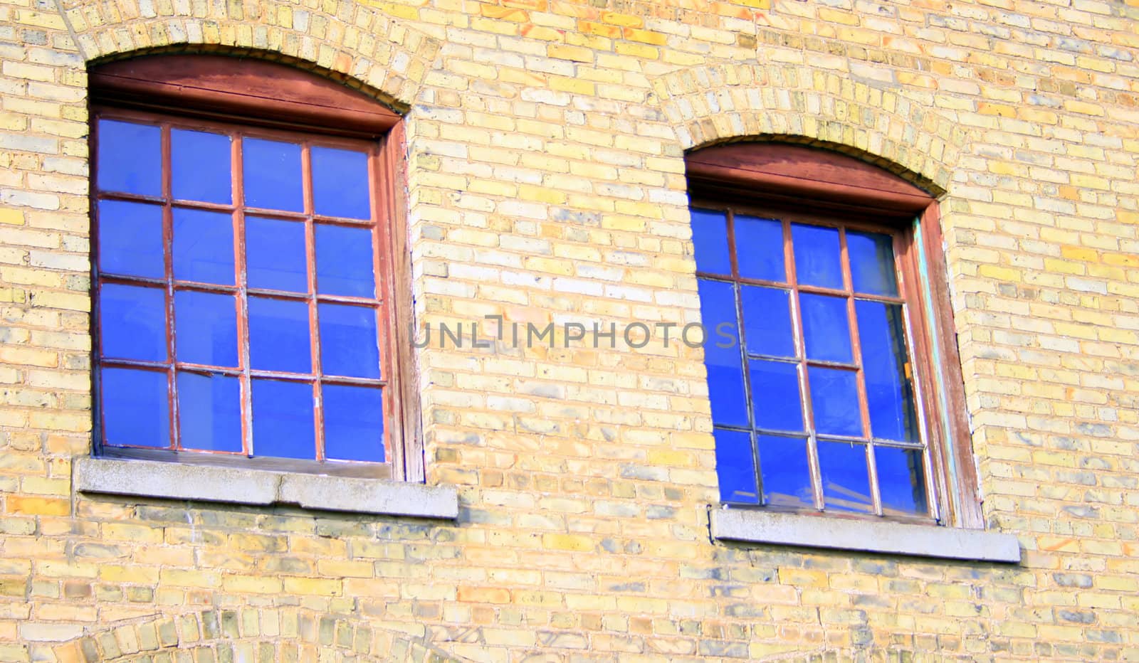 two windows in a 19th century abandoned paper mill