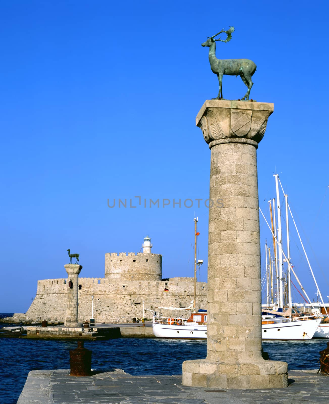 Rhodian deer atop the columns that protect Mandraki harbour entrance, on the Greek island of Rhodes