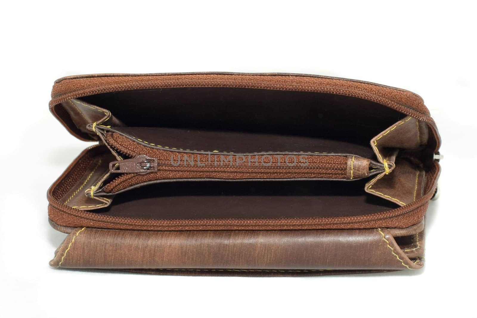 opened and empty brown leather wallet, isolated on white