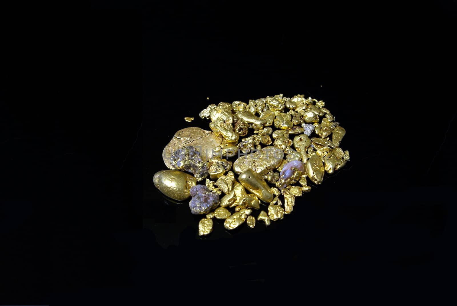 Gold nuggets, flakes and dust mined from the creeks and rivers of california
