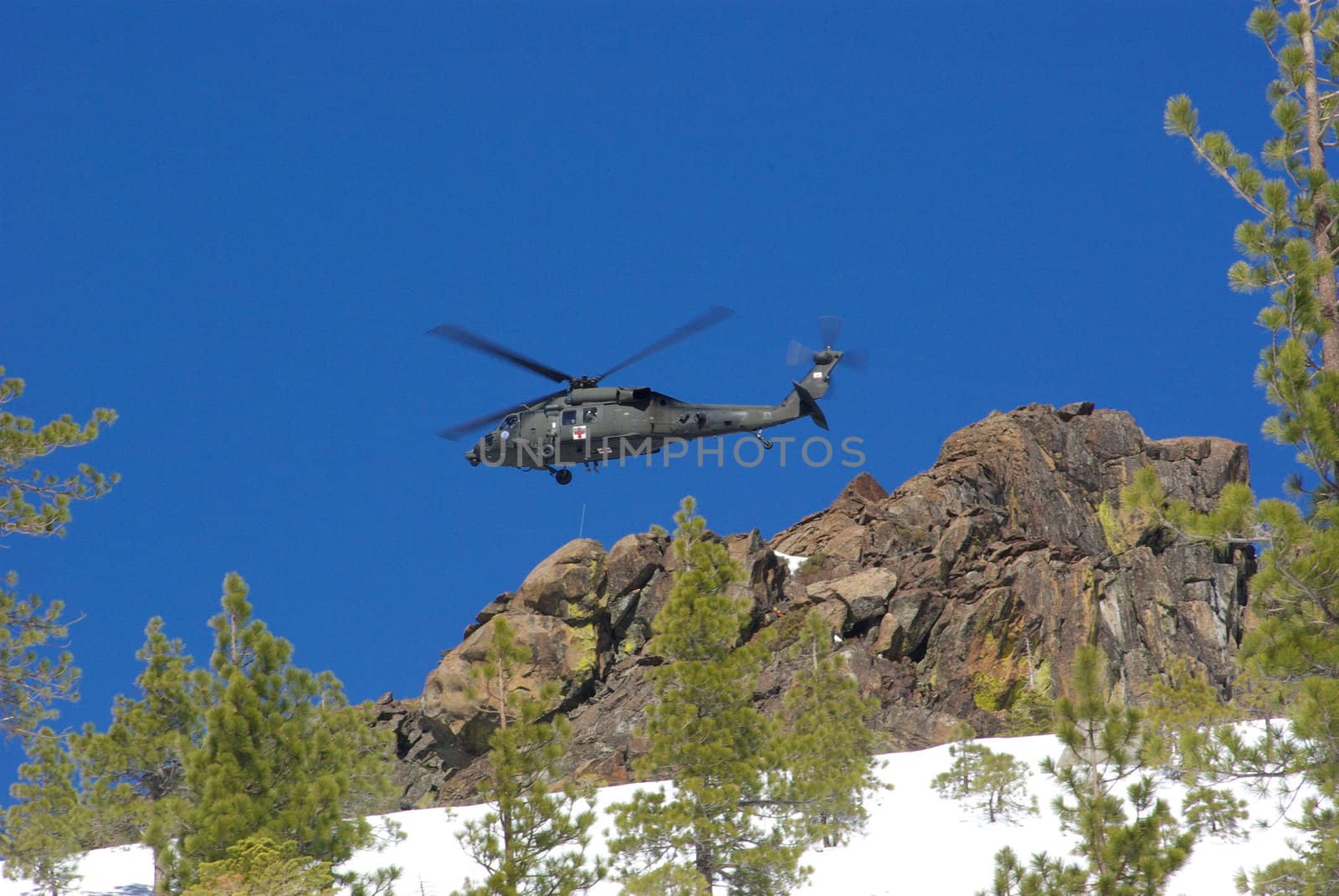Air rescue by helicopter in the mountains at high altitude