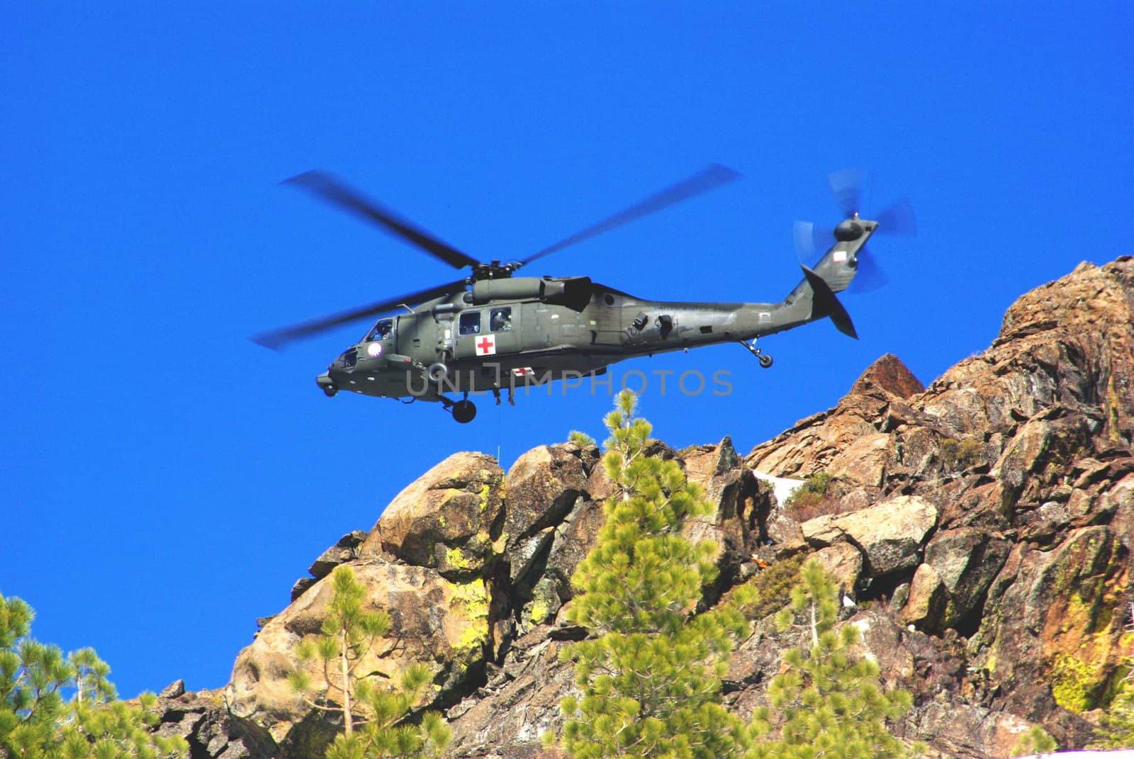 Air rescue by helicopter in the mountains at high altitude