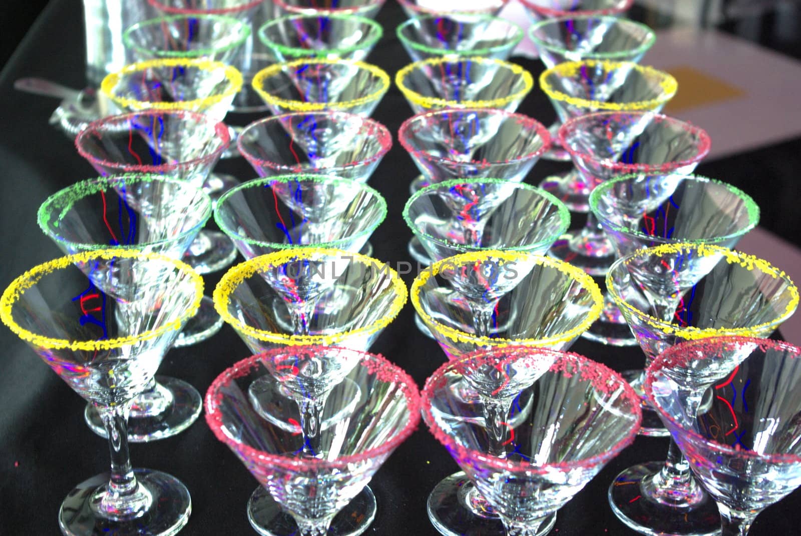 Colorful green, red and yellow Martini cocktail glasses