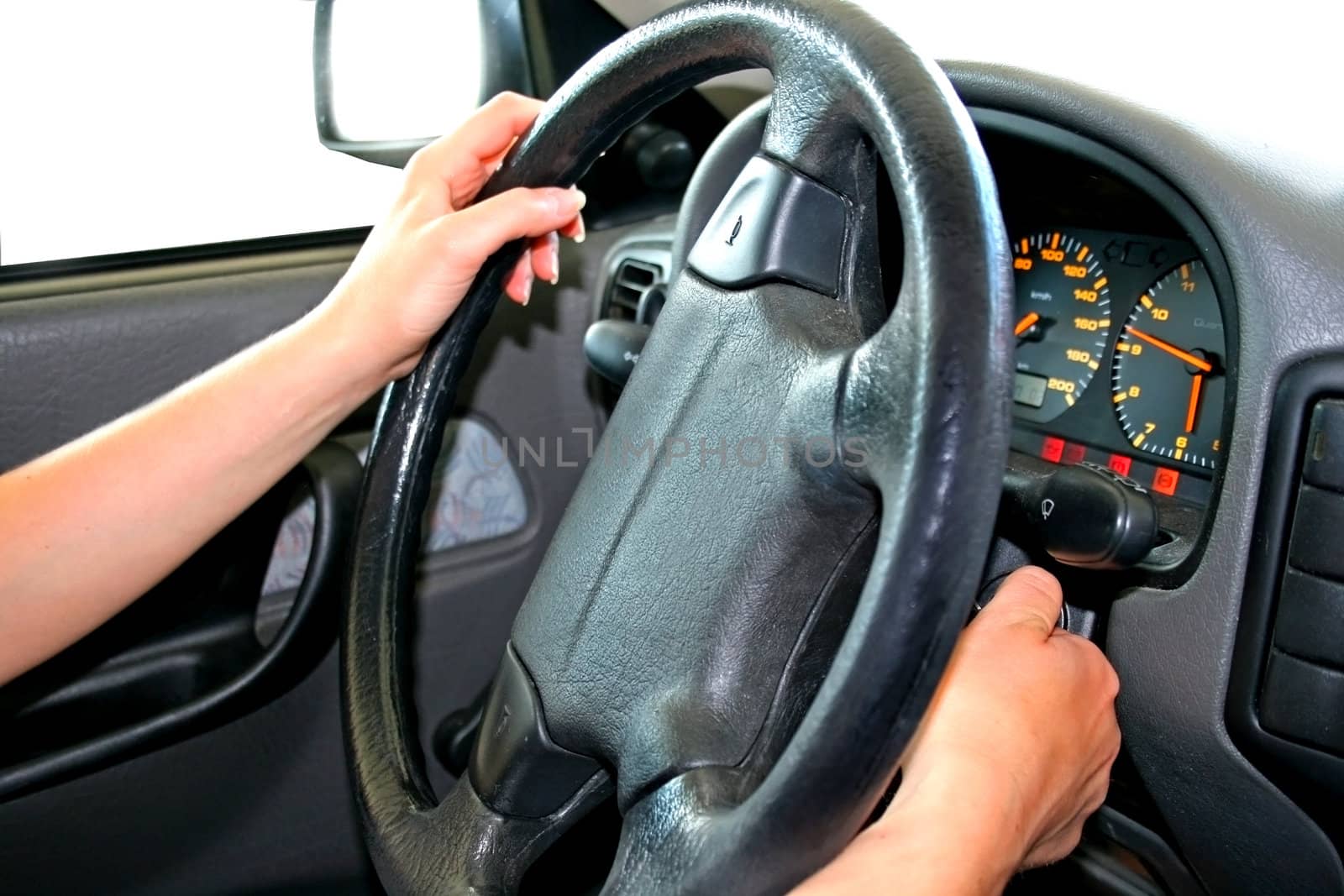 female driving a car on white background