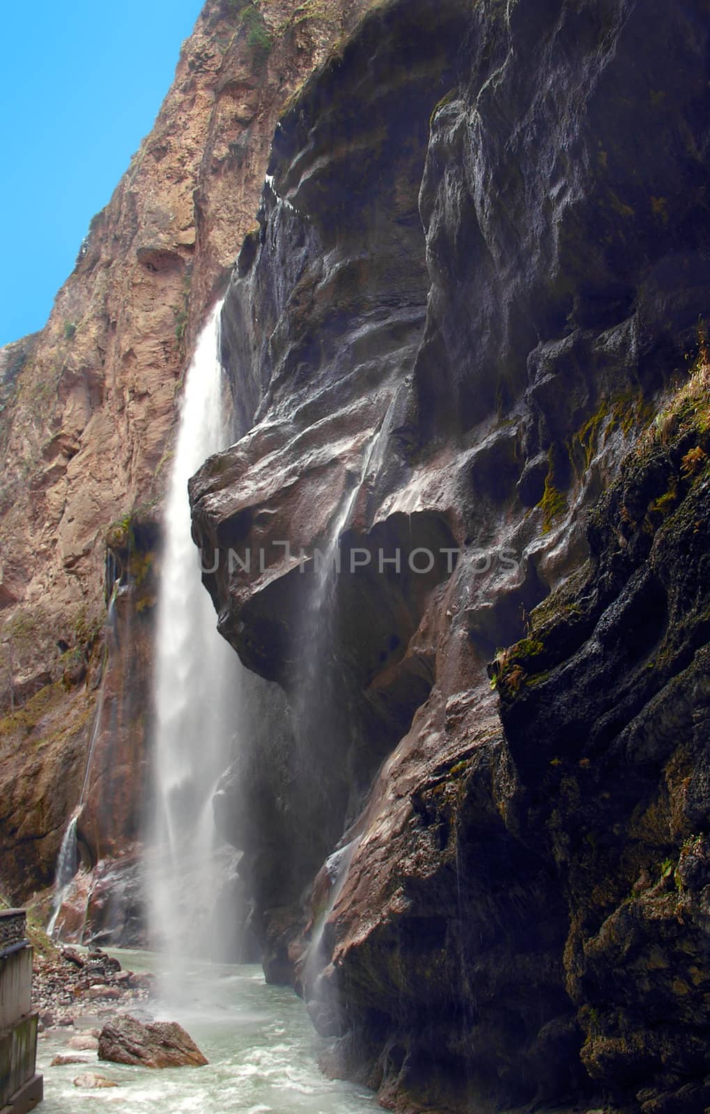 Waterfall in mountains of Caucasus