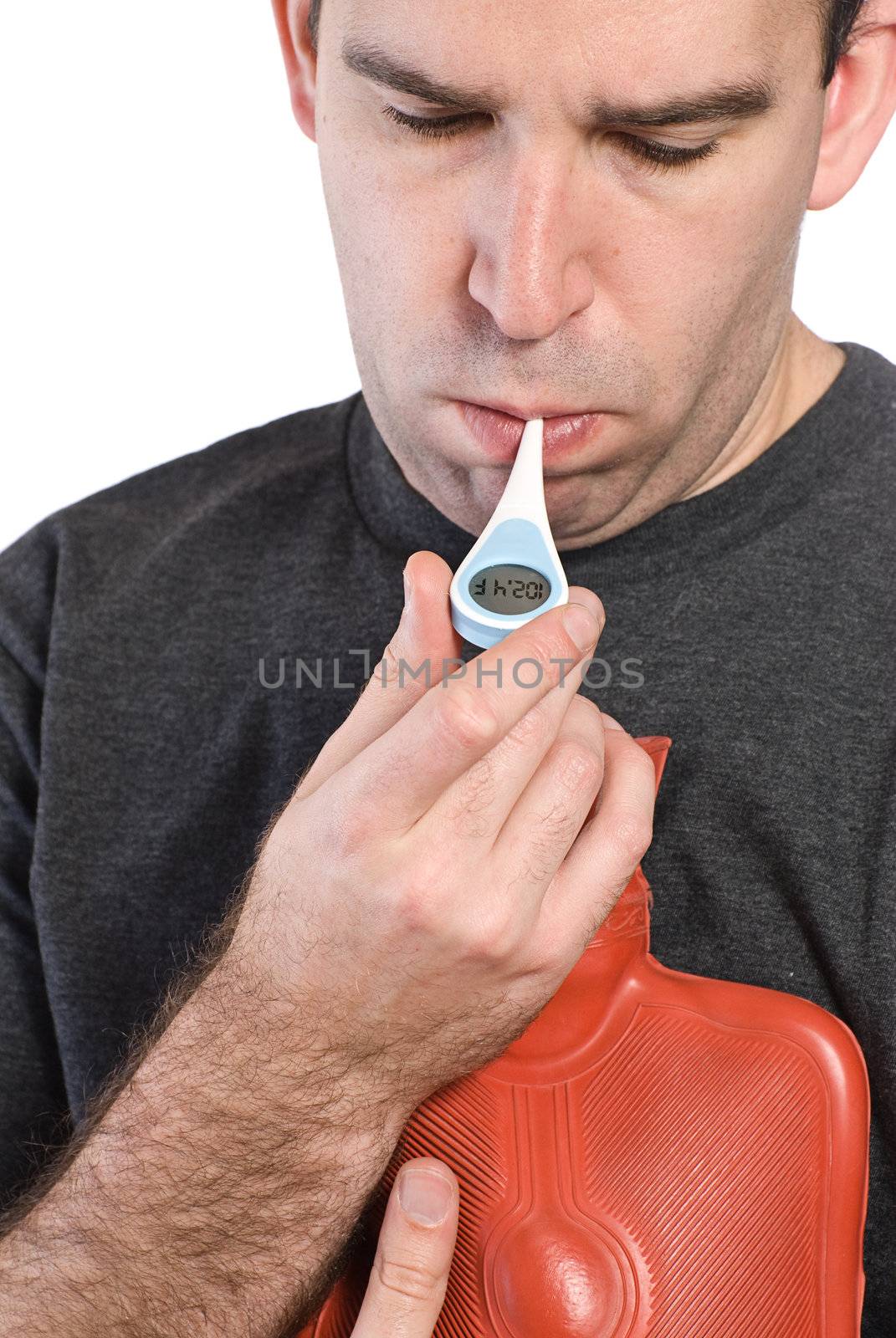 Closeup view of a young man taking his temperature and showing a fever of 102.4 degrees fahrenheit, isolated against a white background