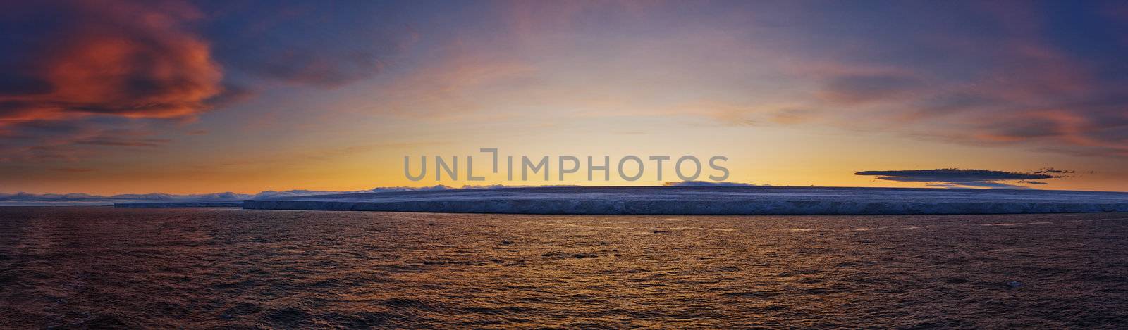 Frozen coastline at sunset.  Horizontally framed shot.