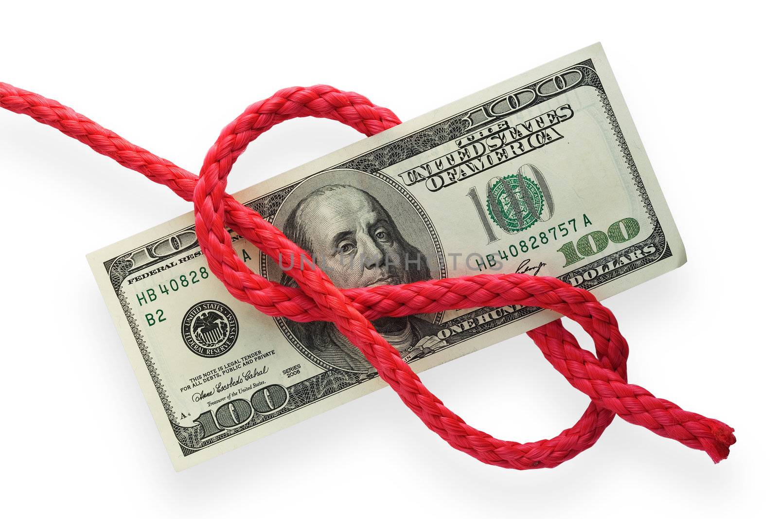 The red cord with figure-eight knot on a banknote. Isolated on white. Conception of risk or difficulty.
