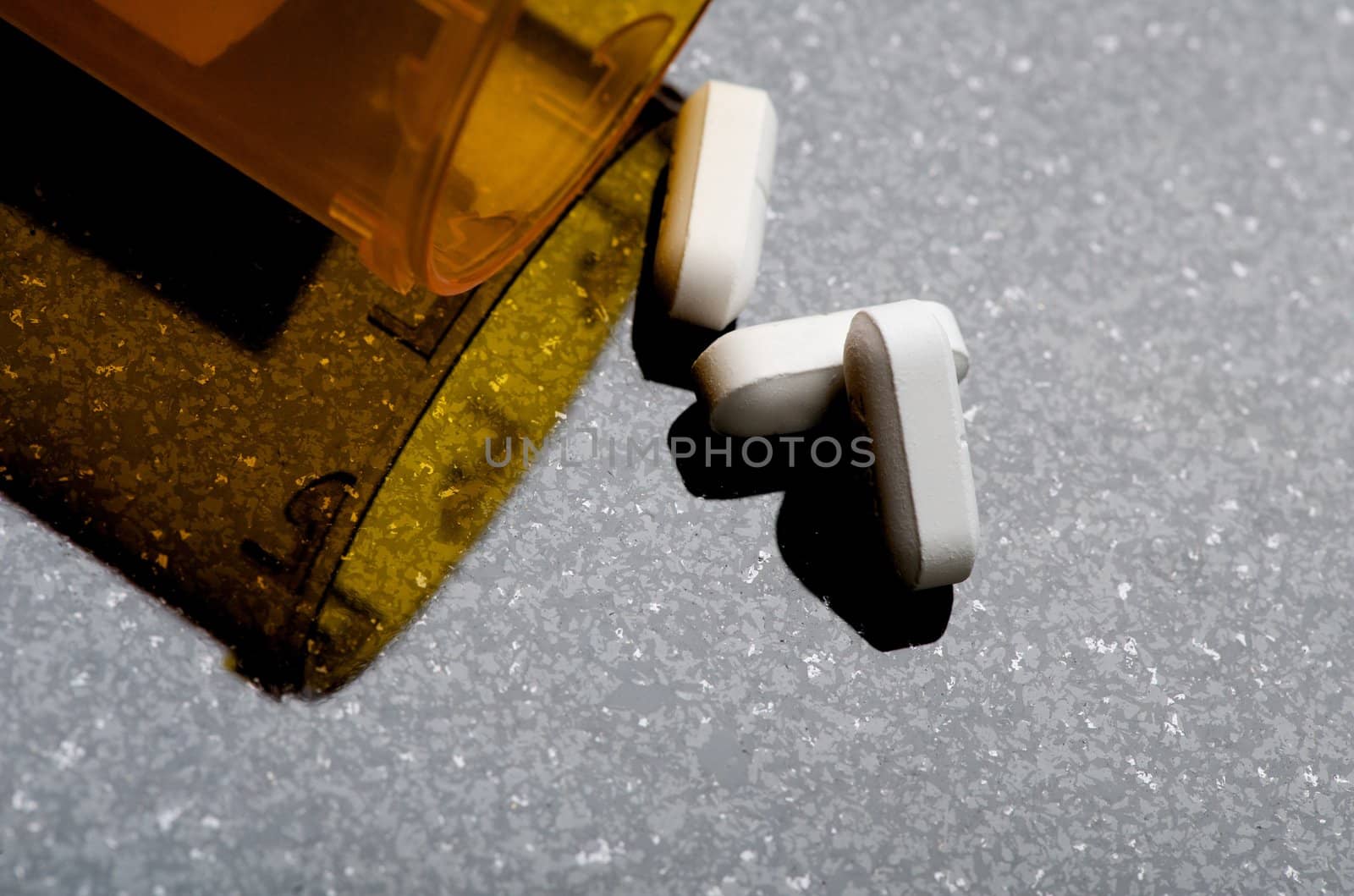 Image of a pill bottle with pills