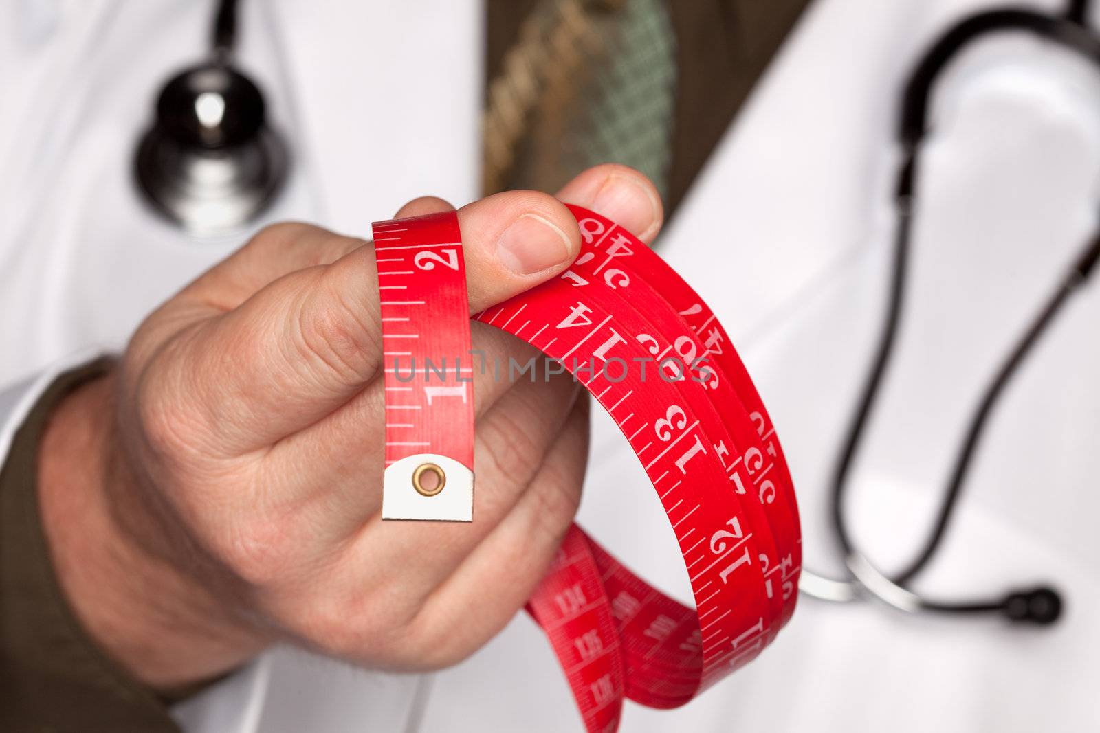 Doctor with Stethoscope Holding Red Measuring Tape.