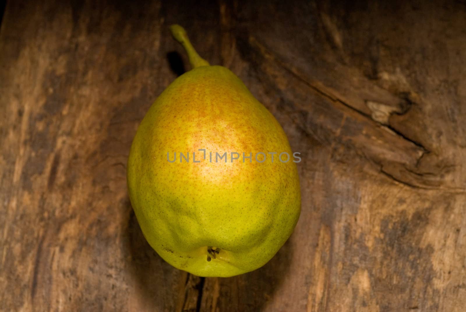 autumn fresh pear over old wood board