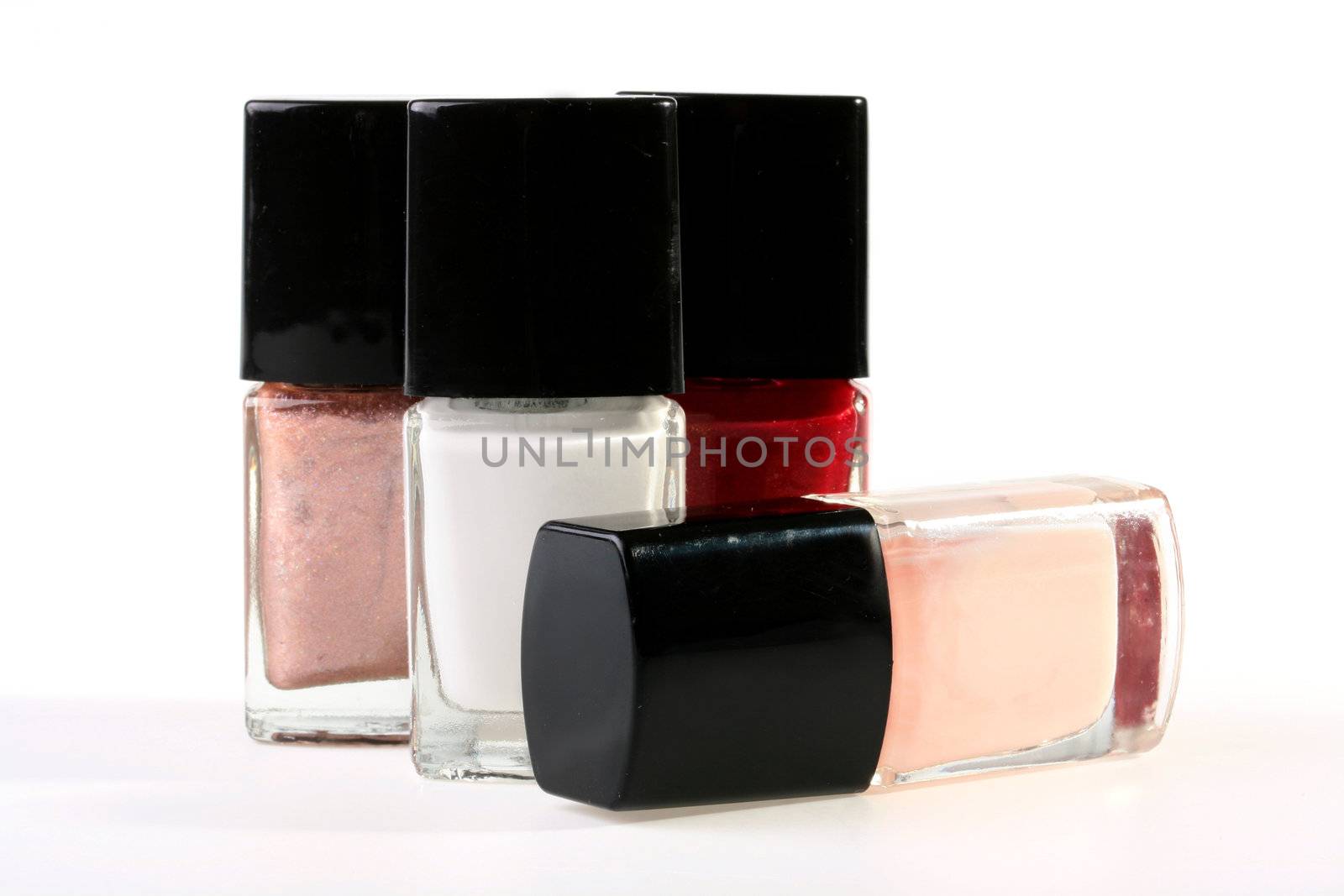 Set of a varnish for manicure in small bottles with brushes.