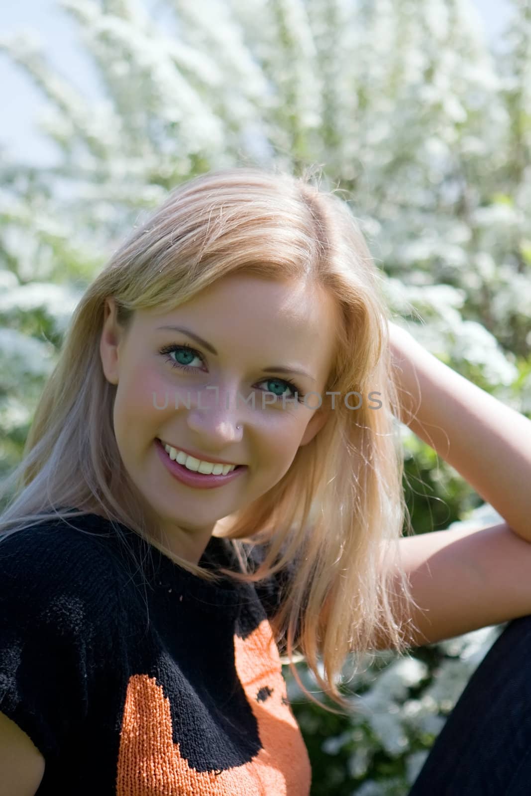 Portrait of the girl having a rest in the summer in park