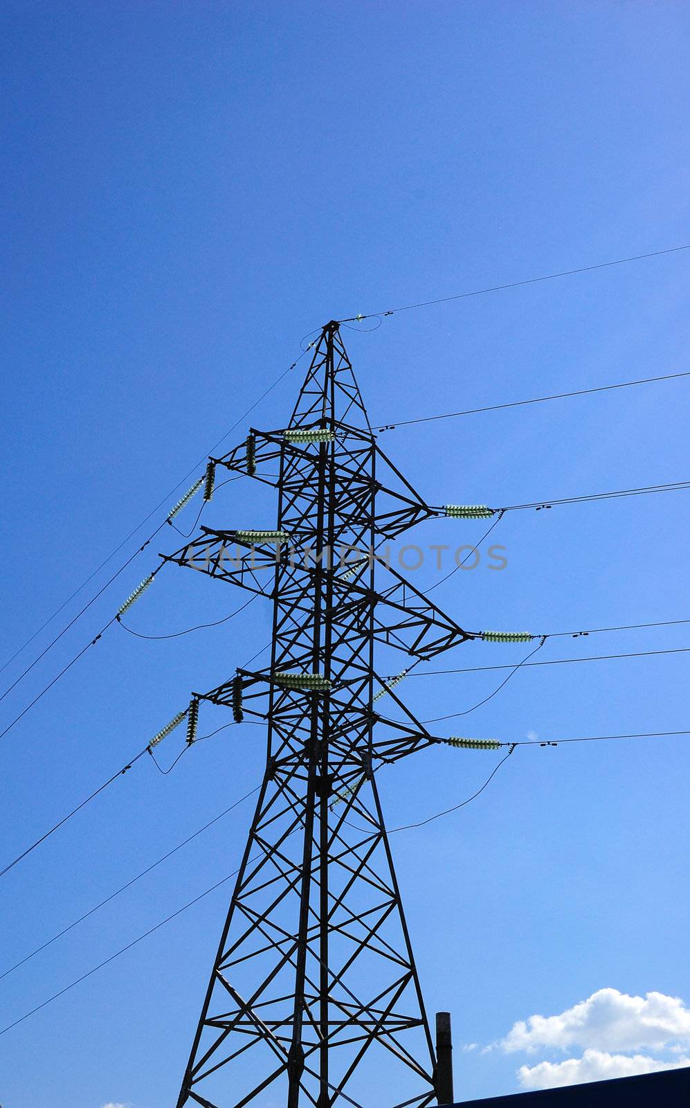 high volts power line on blue sky with insulators and wires