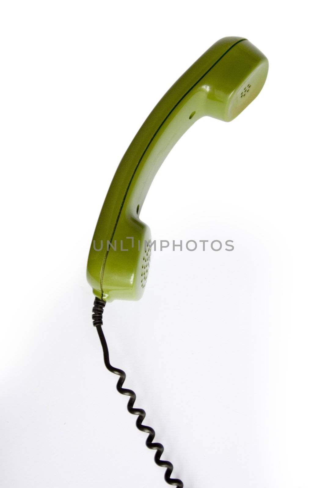 Closeup of green telephone on white