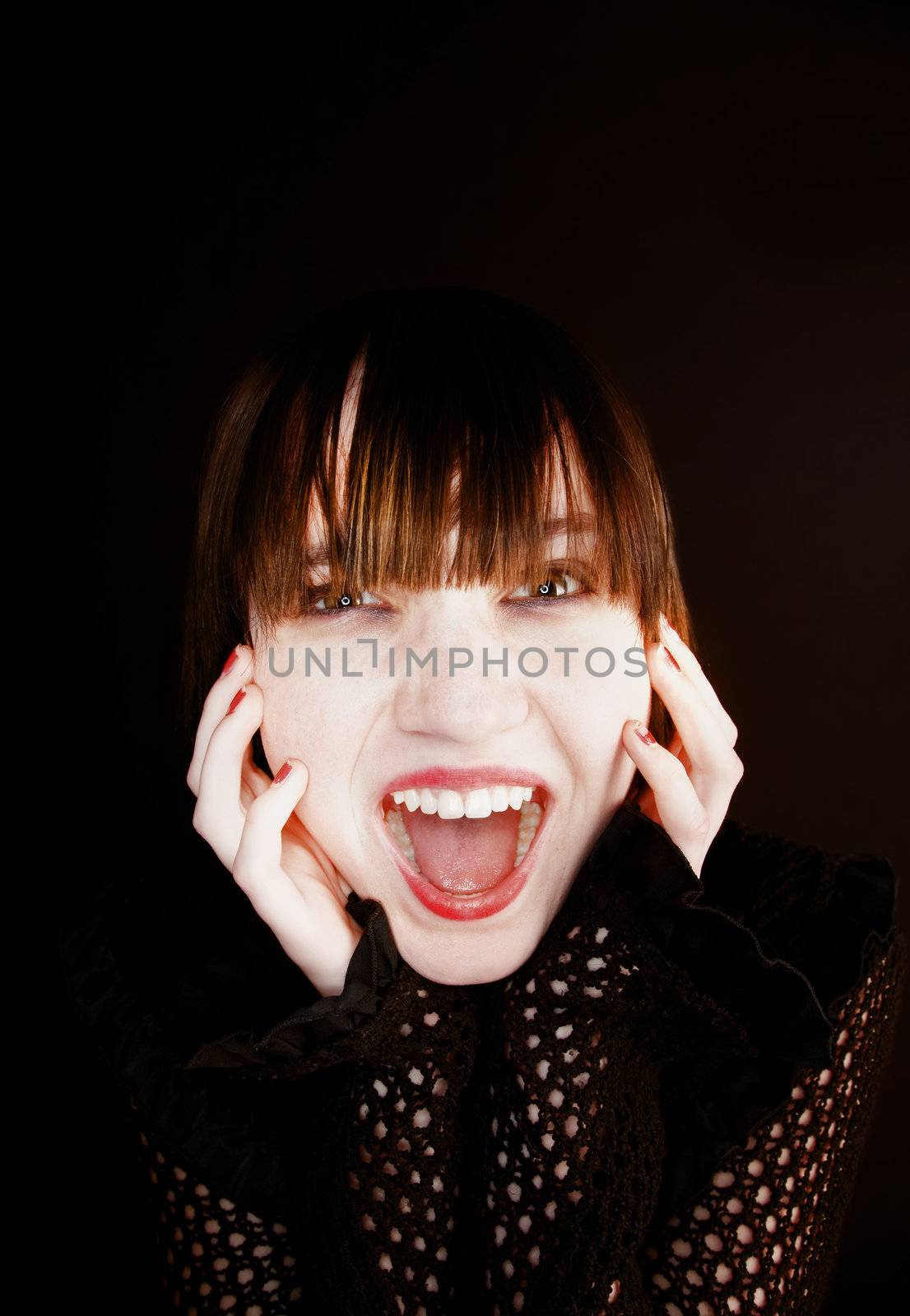 Young Girl with Hands to her face Screaming