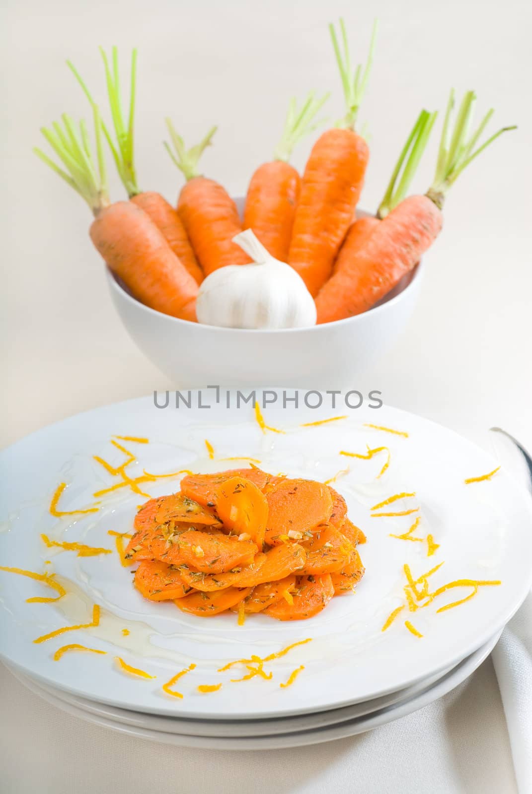 fresh  and healthy Honey glazed carrots on a plate with tyme on top