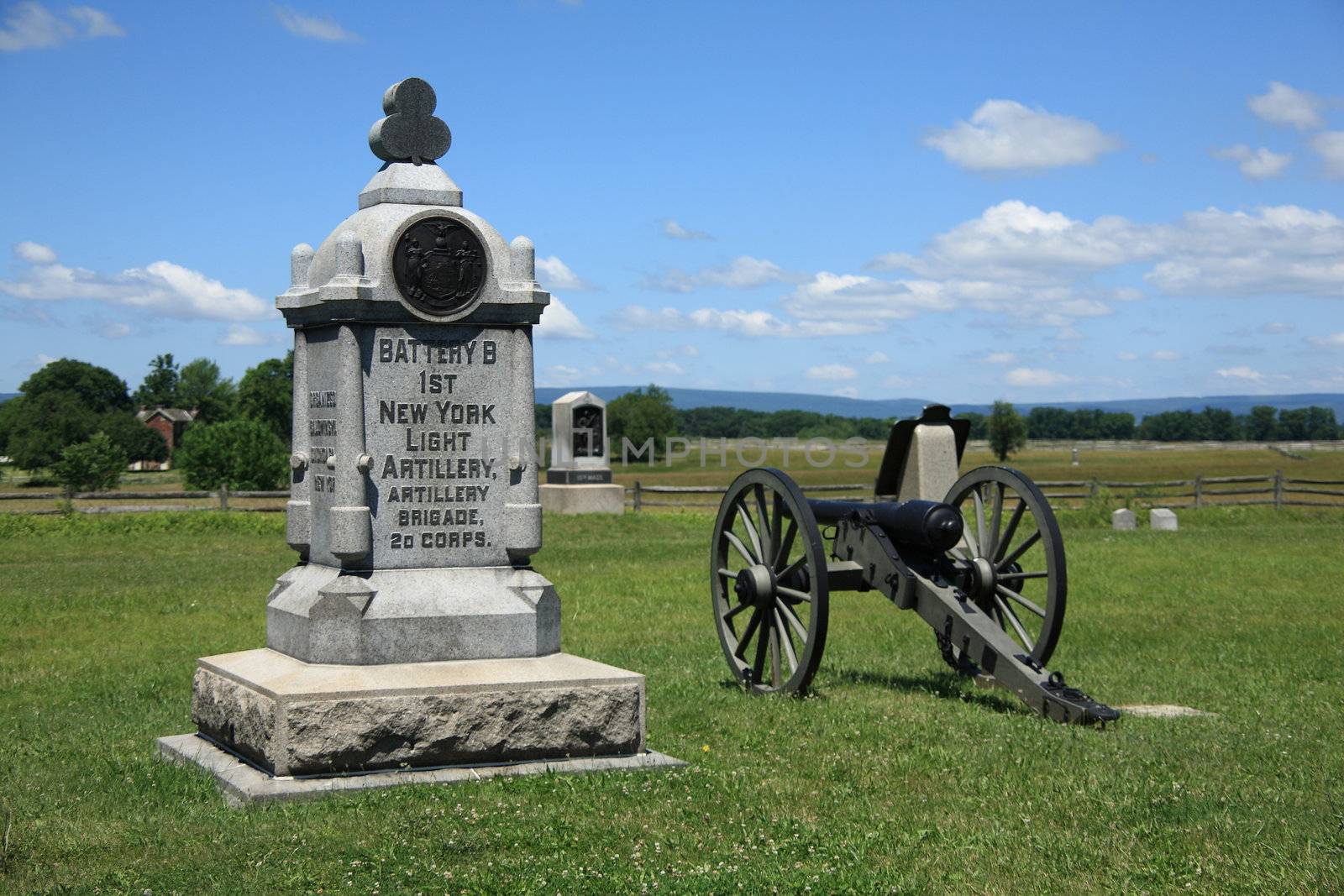 New York monument and cannon on Cemetery Ridge overlook battle site at Gettysburg National Military Park