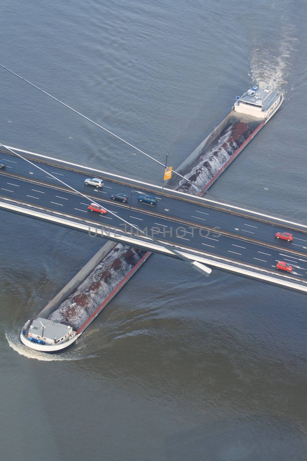 Panorama with container ship under bridge on the Rhine in Dusseldorf