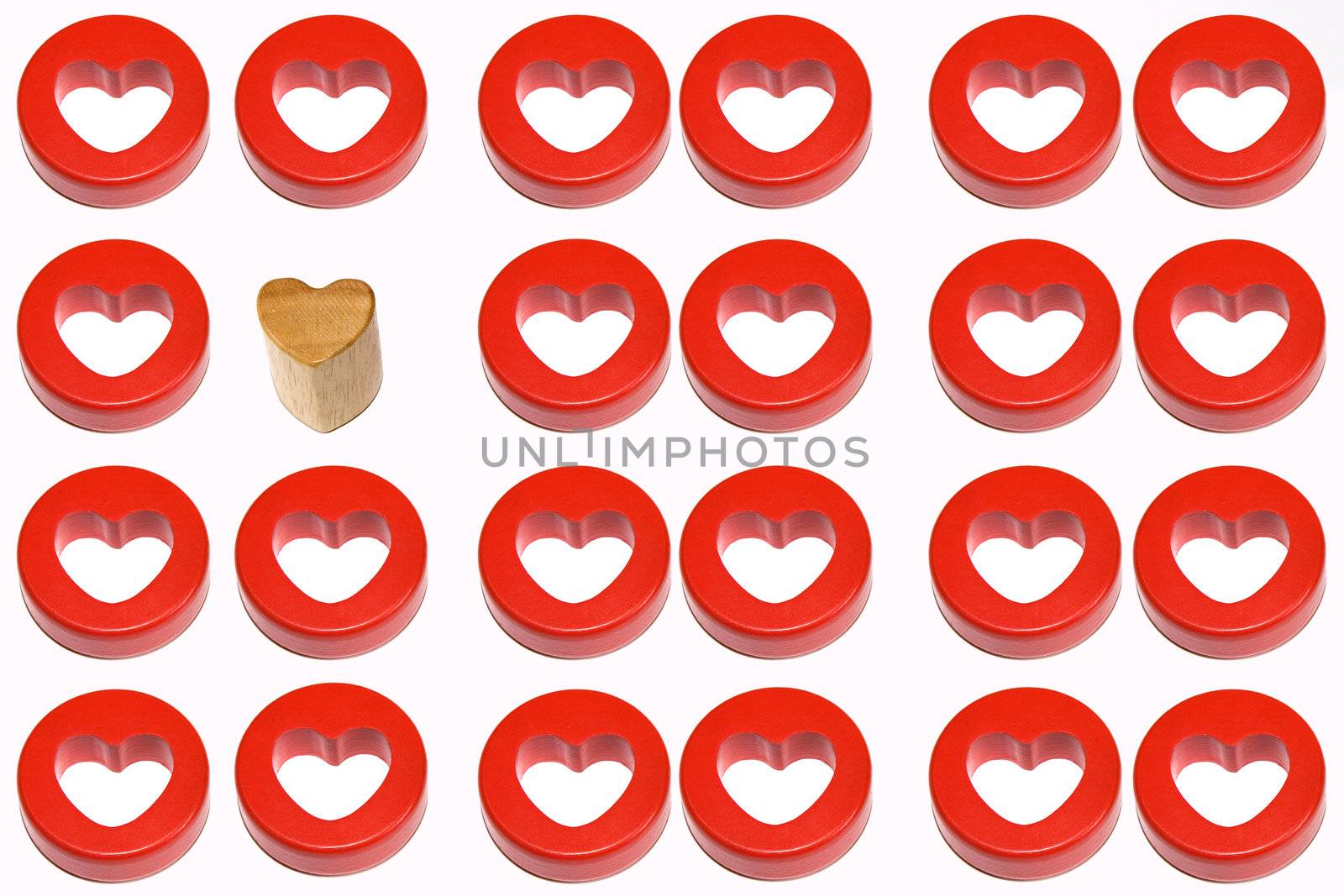 A wooden heart and a red heart next to eleven red heart couples