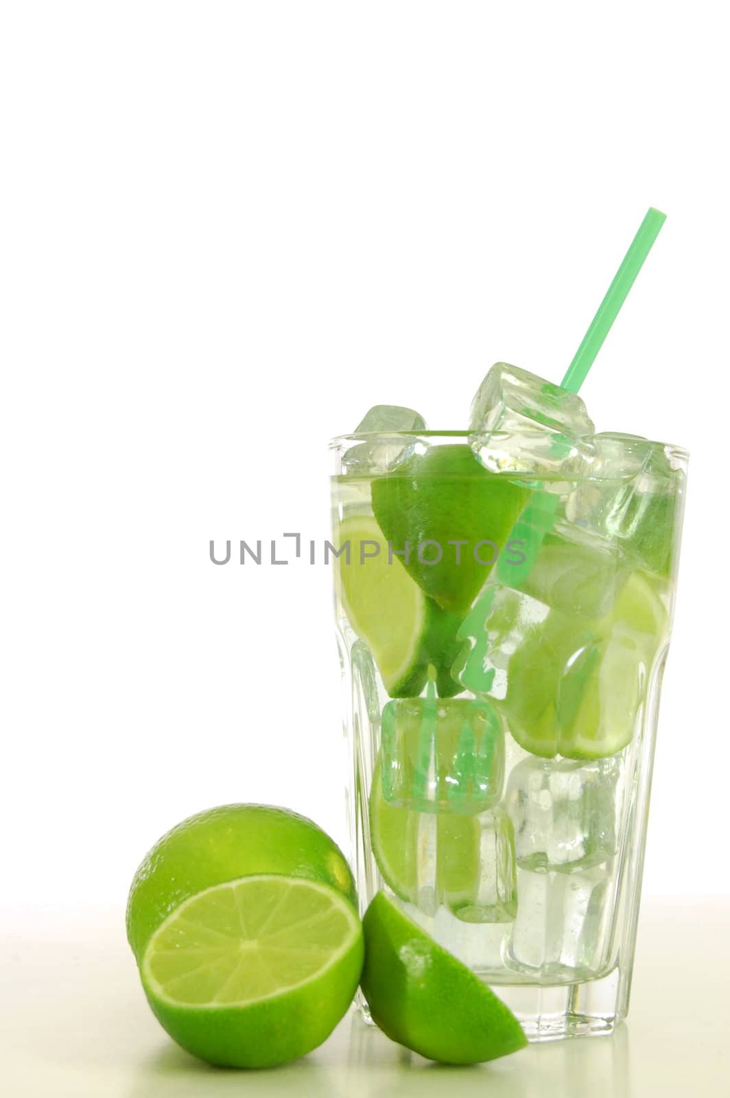 green cocktail with ice cubes and copyspace
