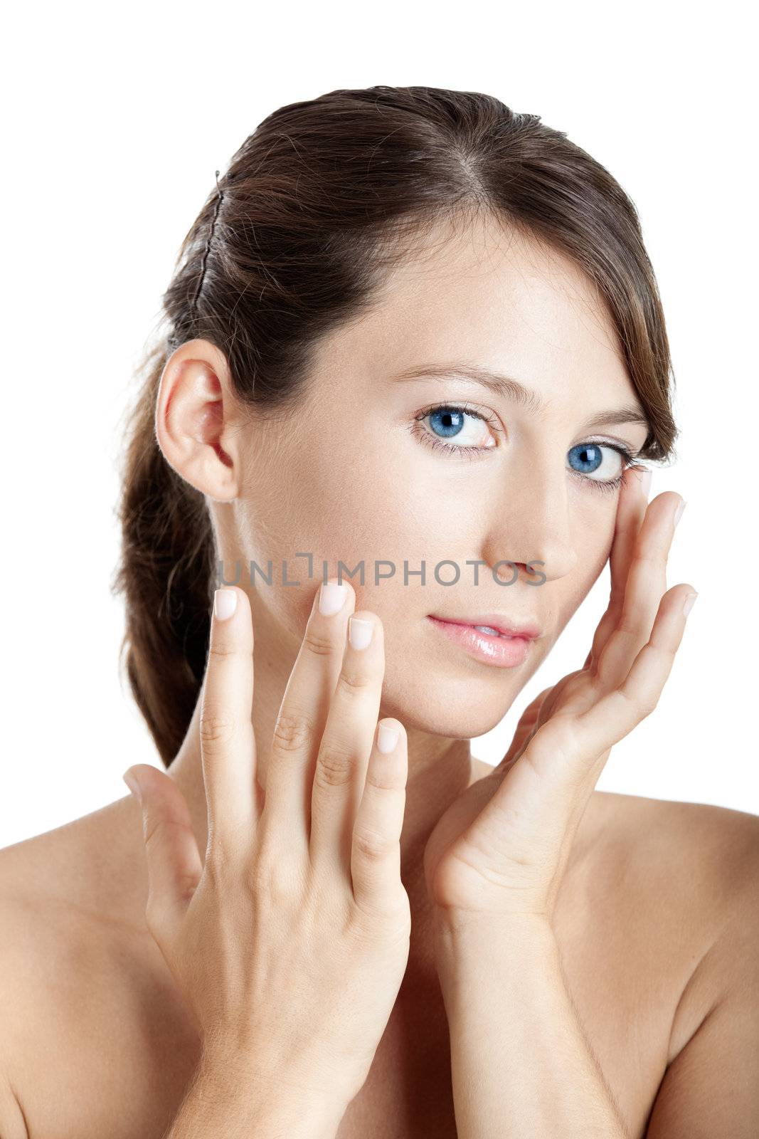 Beautiful young woman taking care of her skin face
