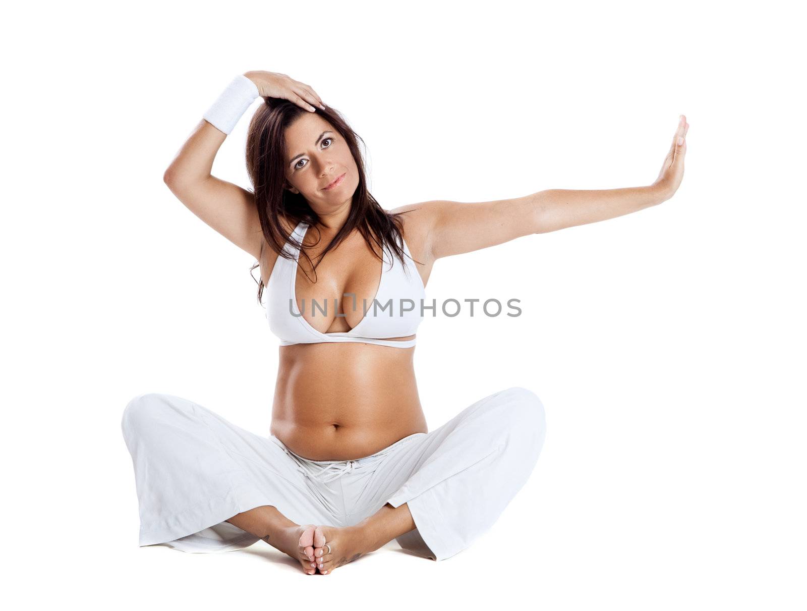 Pregnant woman making fitness exercises, isolated on white