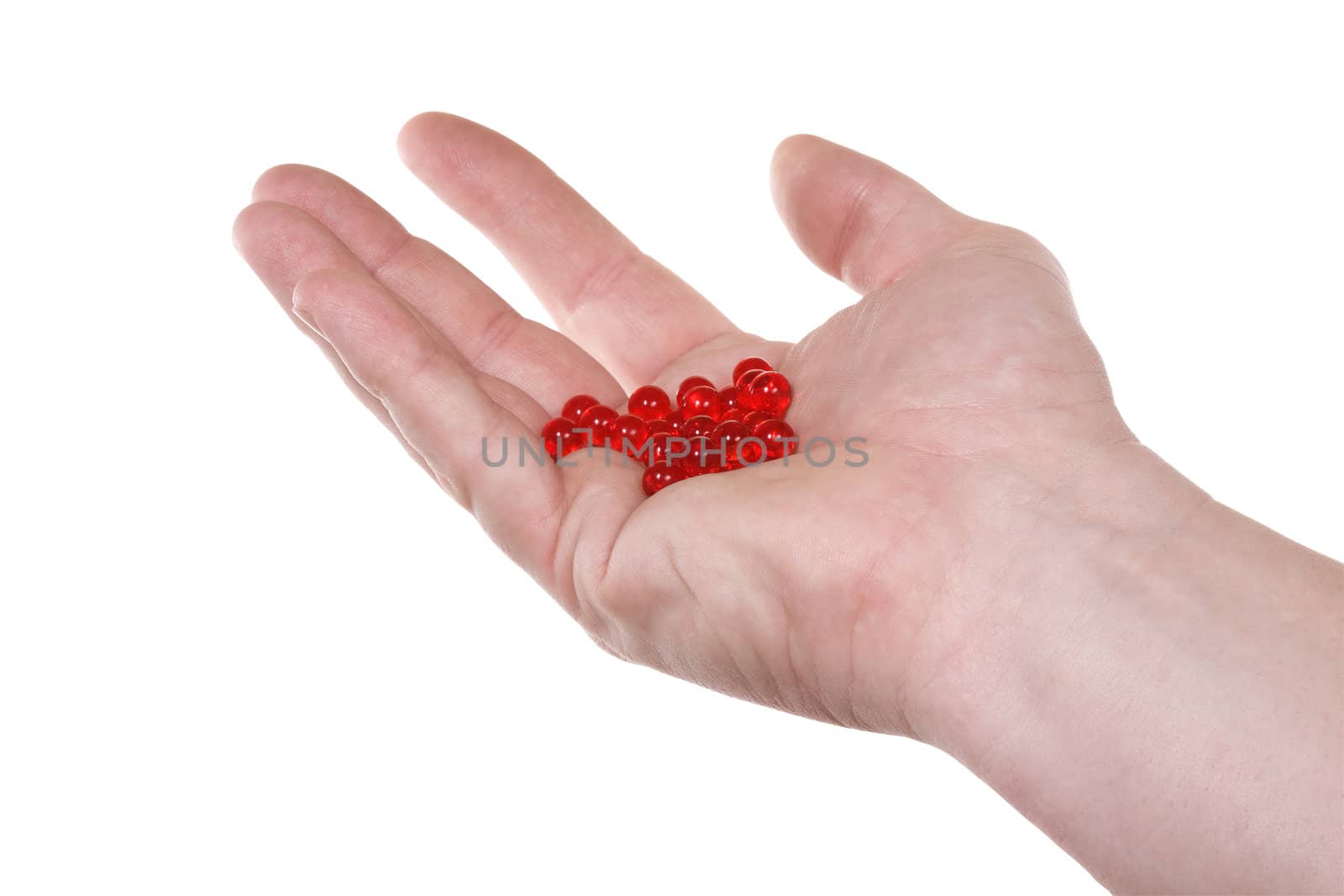 Hand with red pills.  Isolated on white [with clipping path].