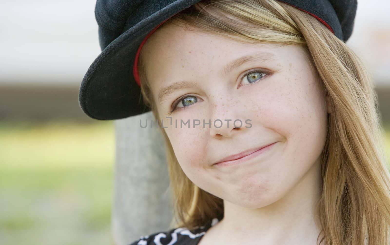 Close up of a young girl wearing a cap