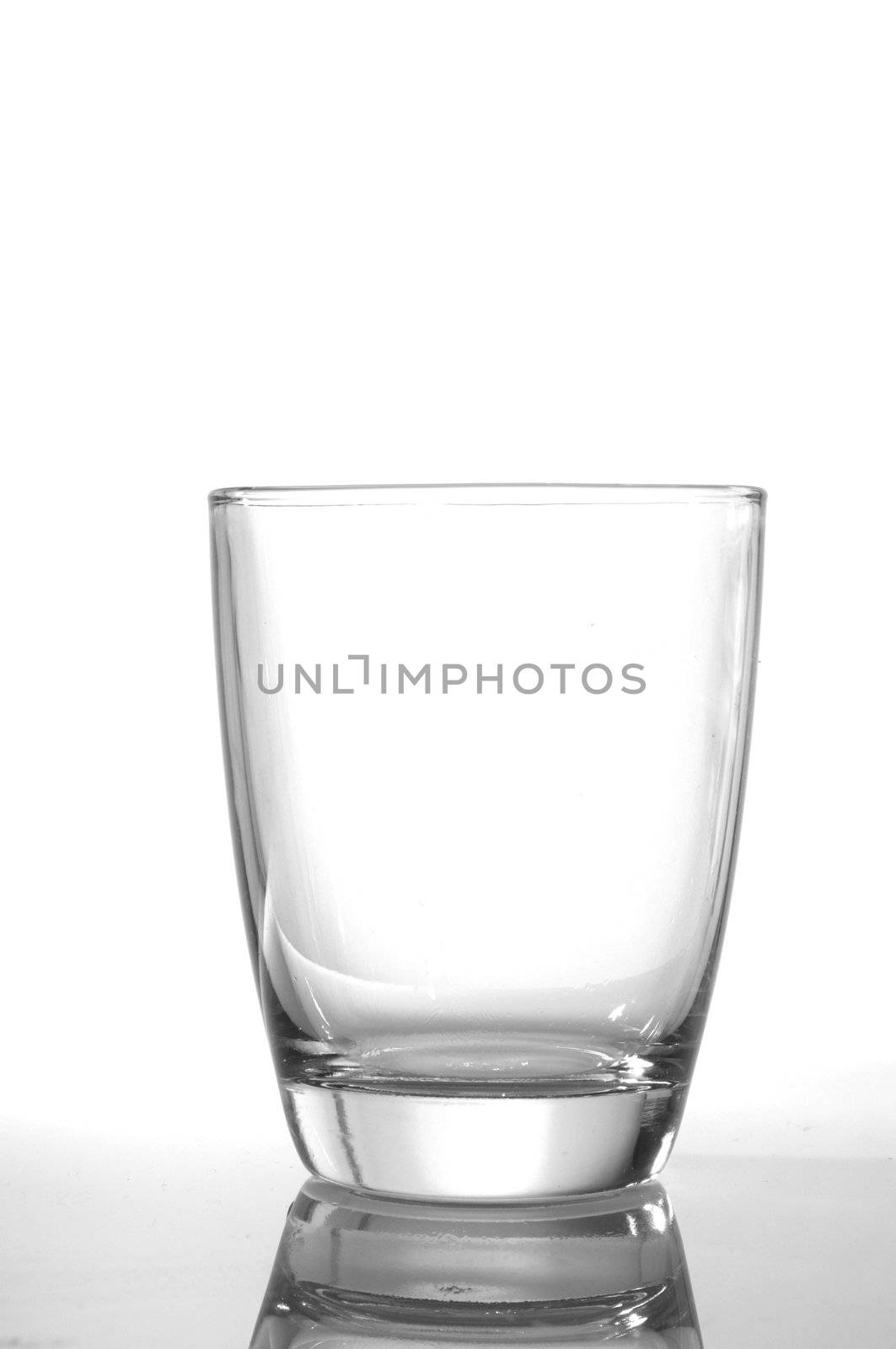 photo of pouring water and glass on white background