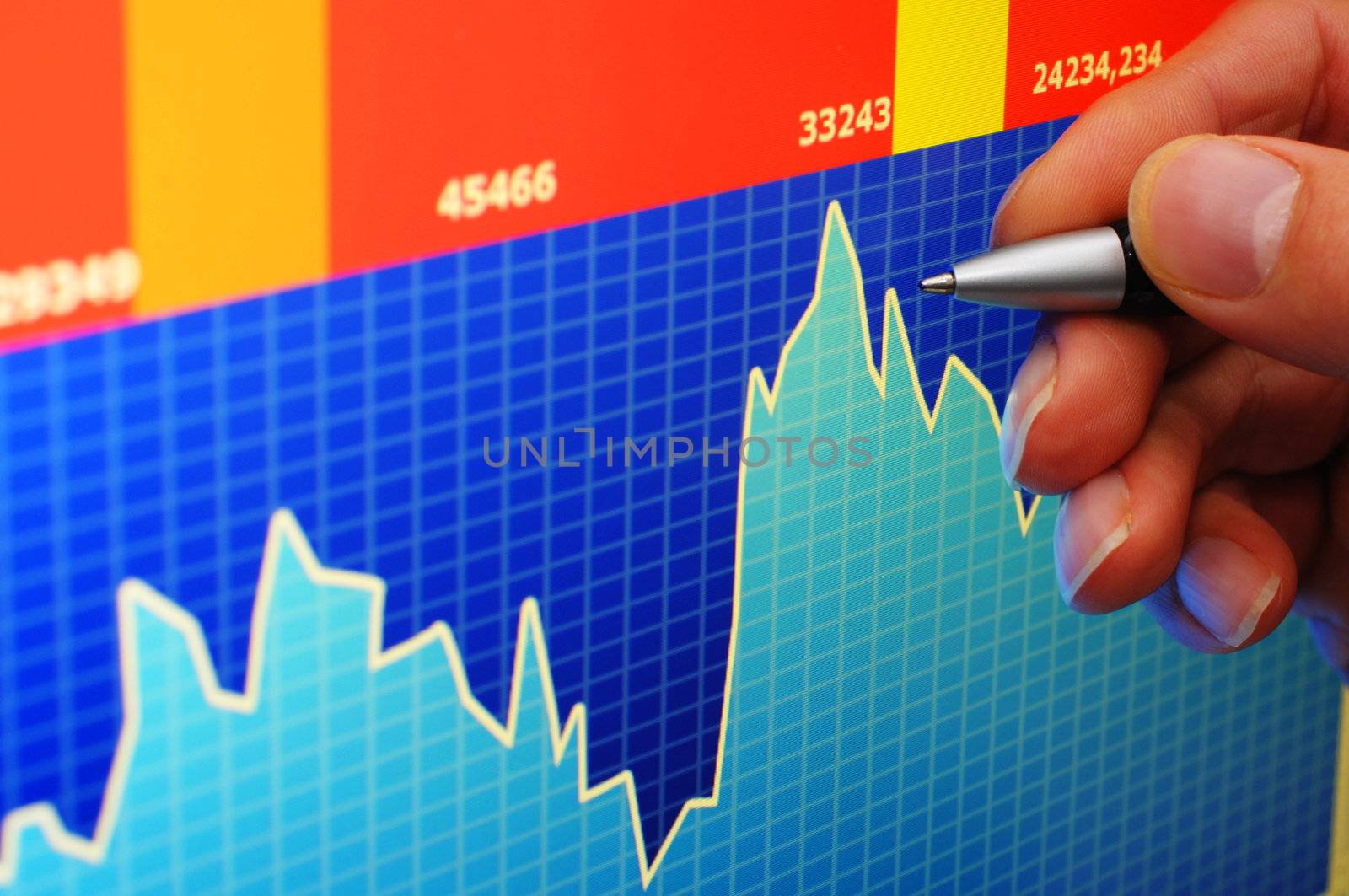 financial stock market concept with hand and computer lcd display