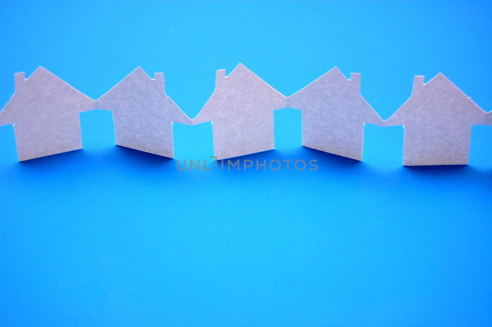 paper houses or homes showing a concept for real estate