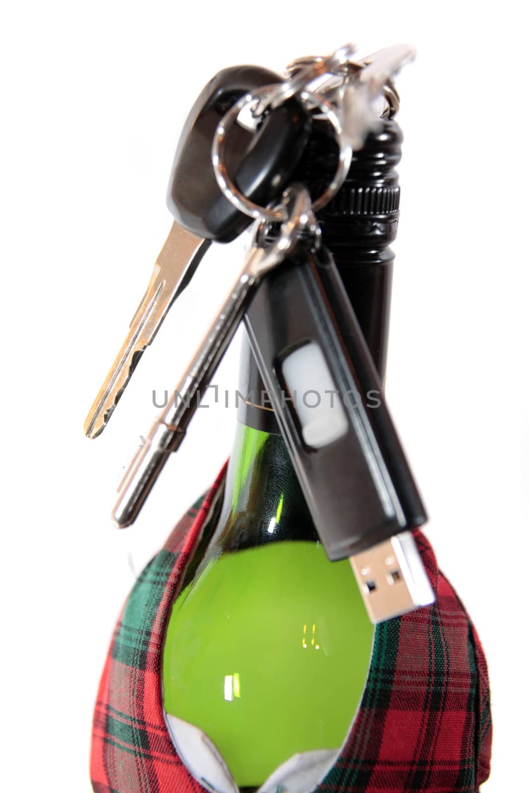 bottle dressed in jacket warmer with keys hanging on alcohol bottle on white background depicting drunk driving and addictions can kill