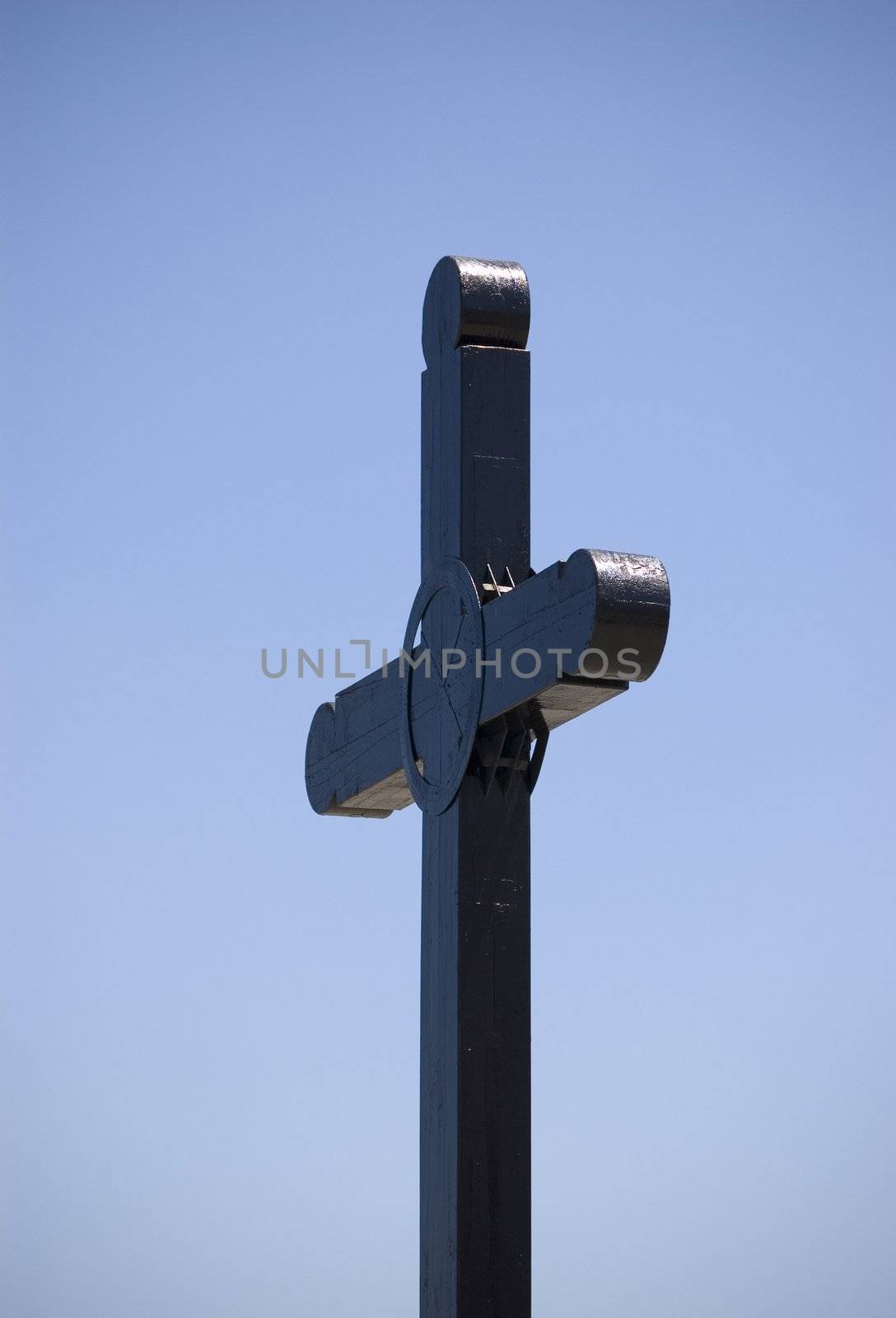 Metal cross with a blue sky as backrground in Mexico