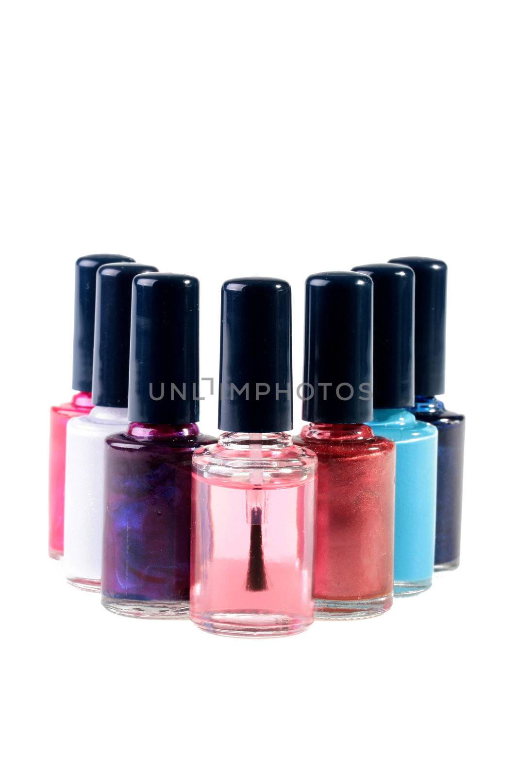 Small bottles with a varnish for manicure on a white background.