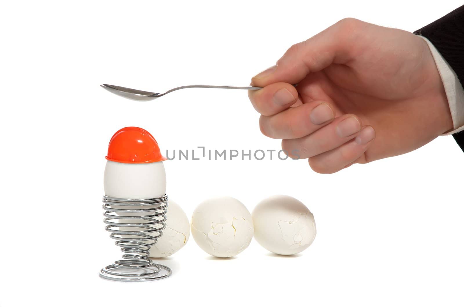 hand broken white egg on iron stand near by split white egg isolated on white background