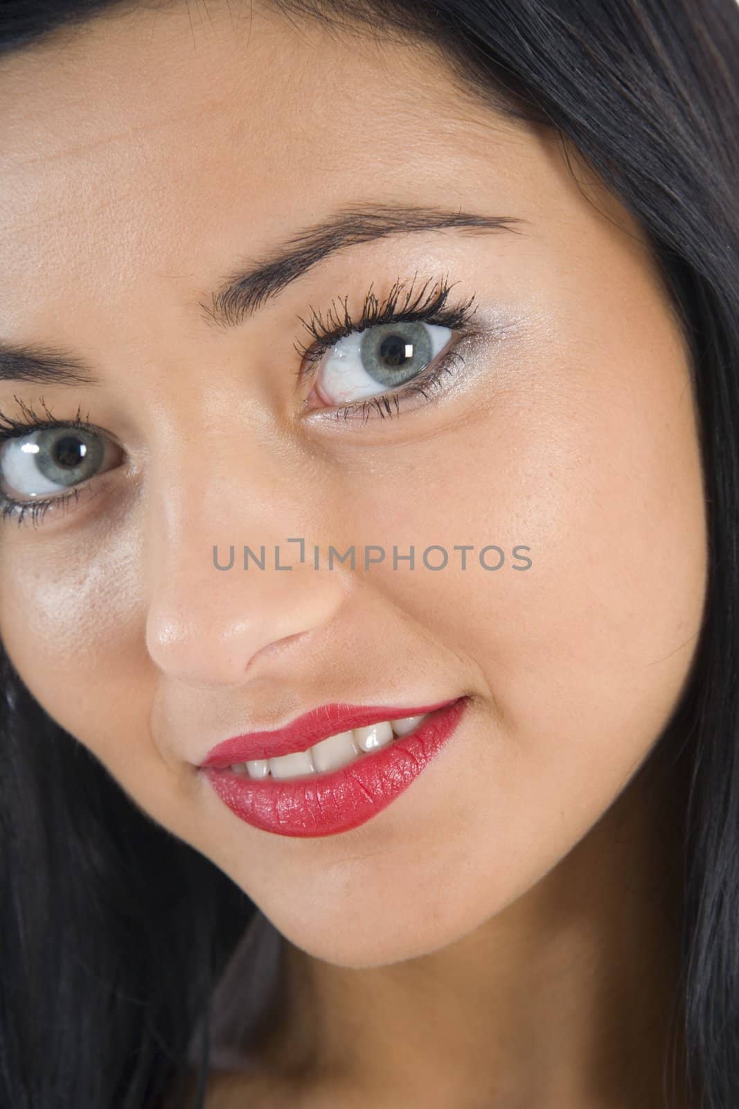 portrait of the brunette with blue eye on insulated background