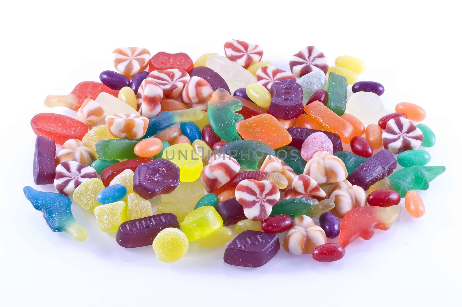 Different kinds of candy on a white background.