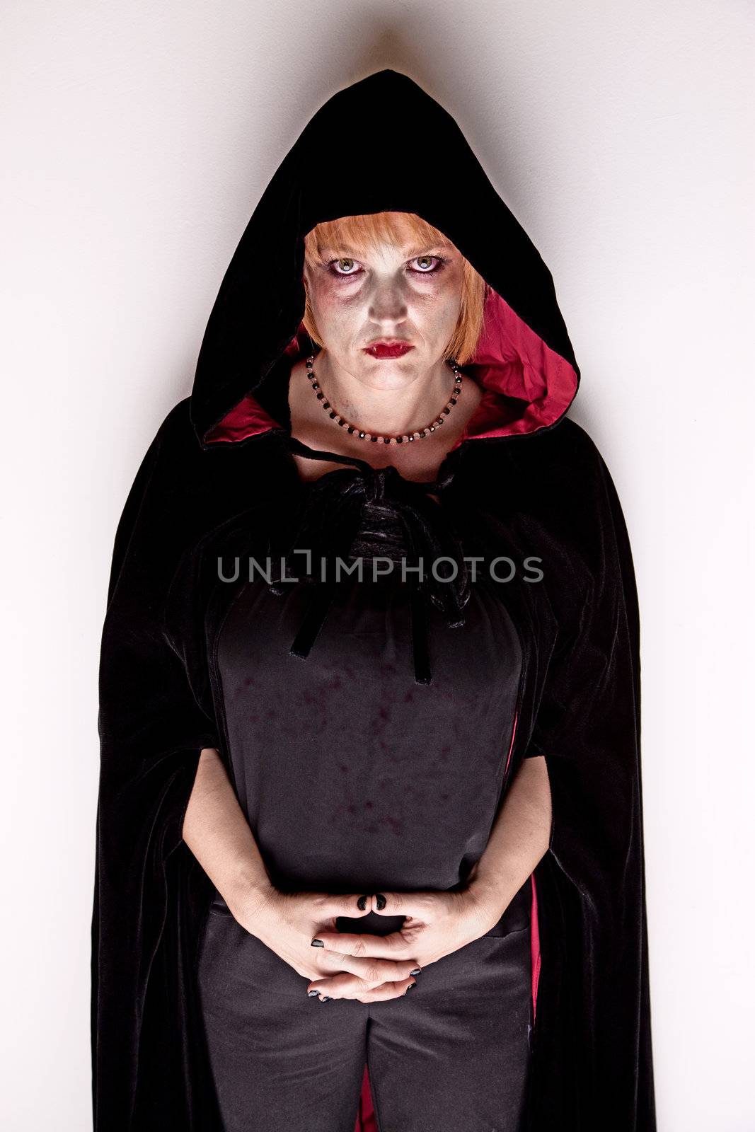 Female Witch or Vampire in a Dark Hood